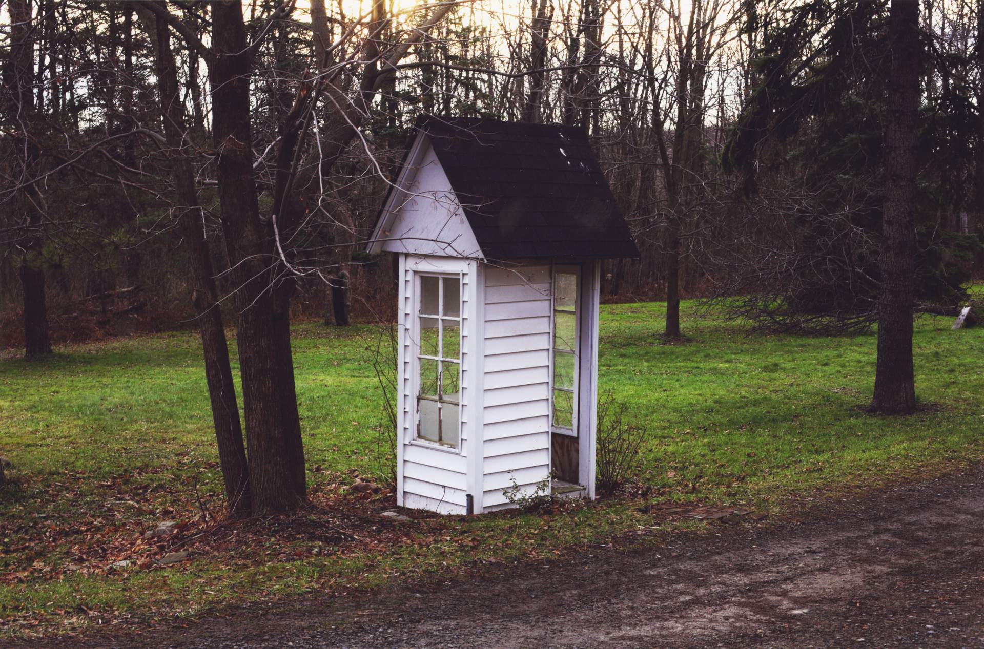 The Mistake by the Lake [white shelter with windows and black roof]