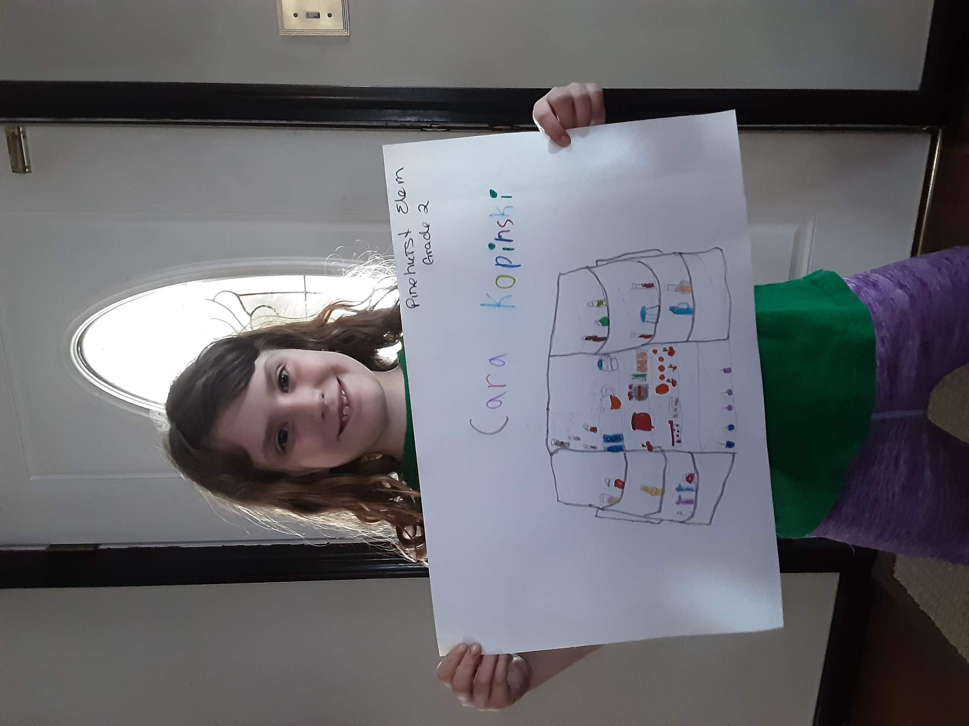 Cara with her drawing for "What's in Your Fridge?"