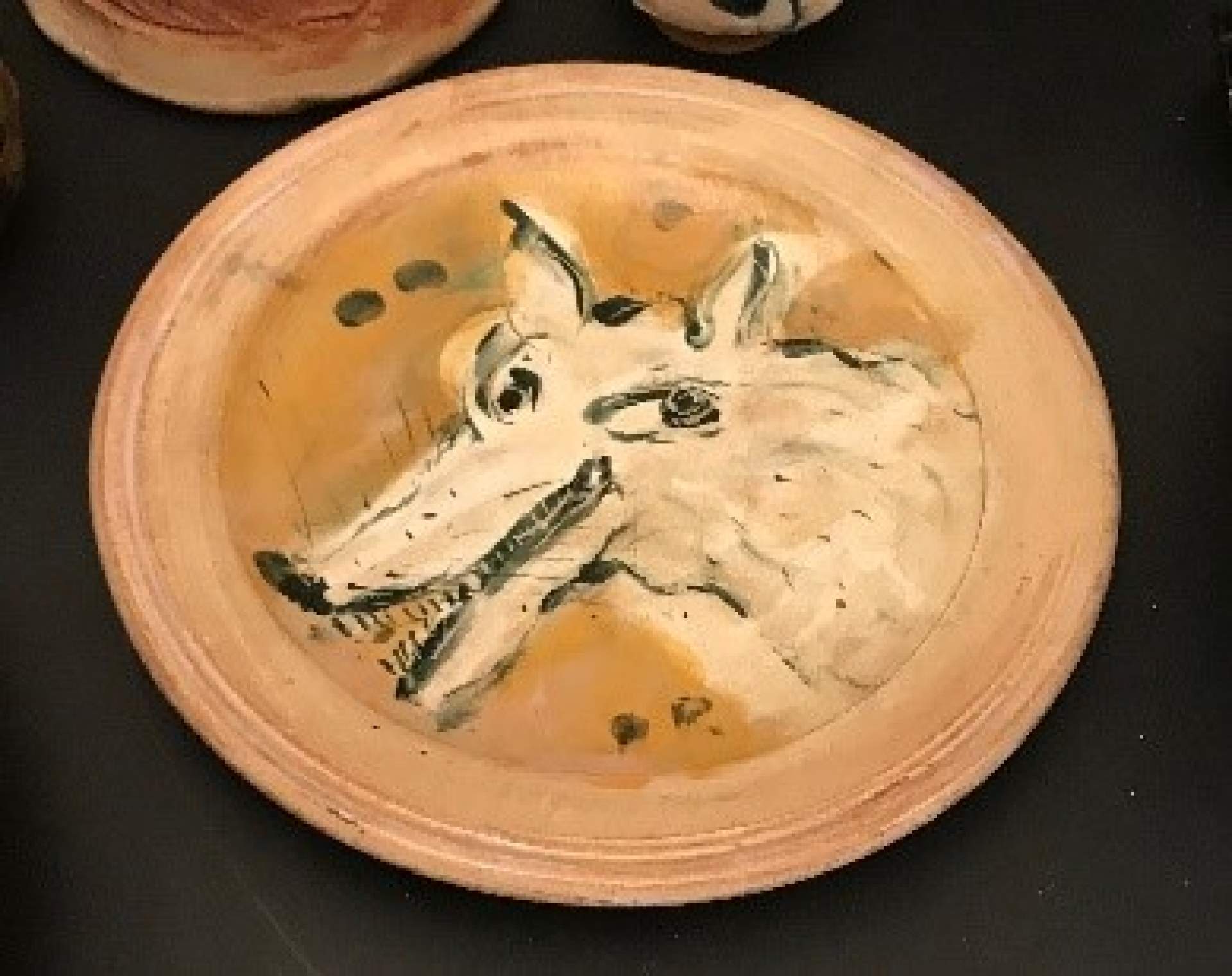 Dish with Leering Wolf